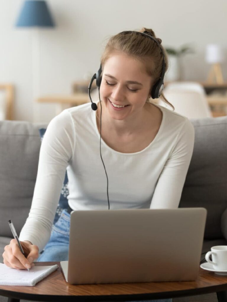 White women studying from home receiving help for her exams by an online tutor