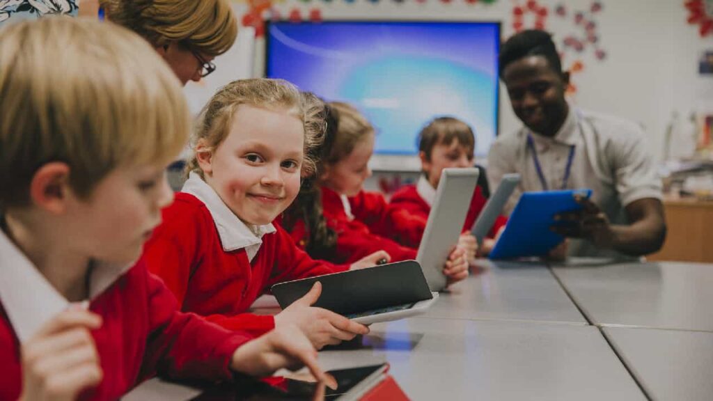 School children in UK using smart tablets in class