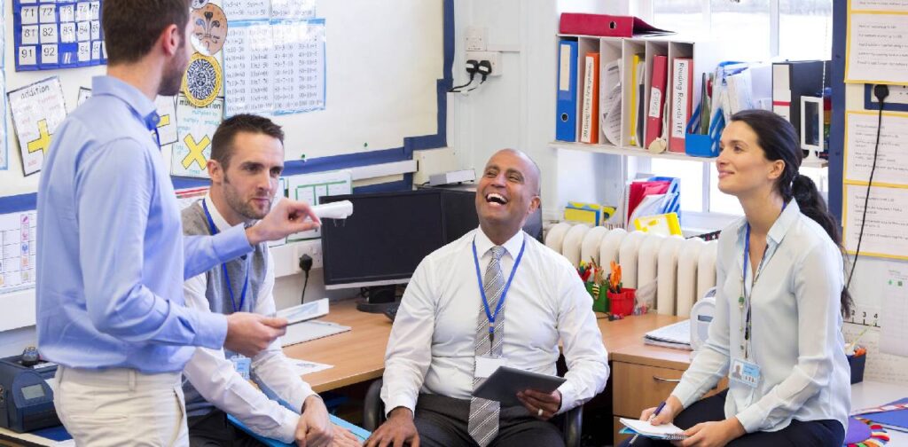 Teachers having a meeting before school starts and catching up with each other.