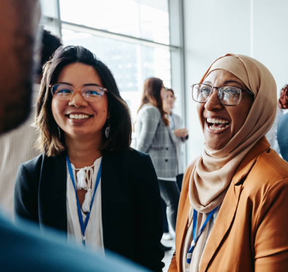 Two female colleagues laughing