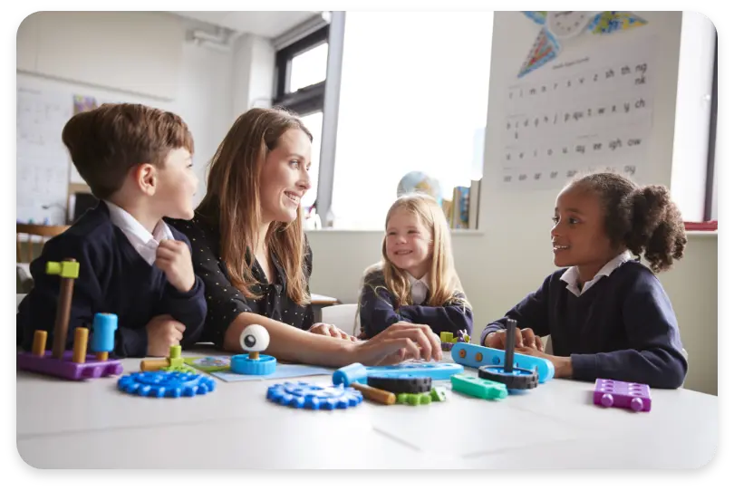 teacher speaking with 3 children