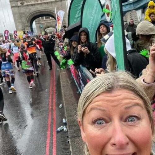 Gail smiling running the London Marathon